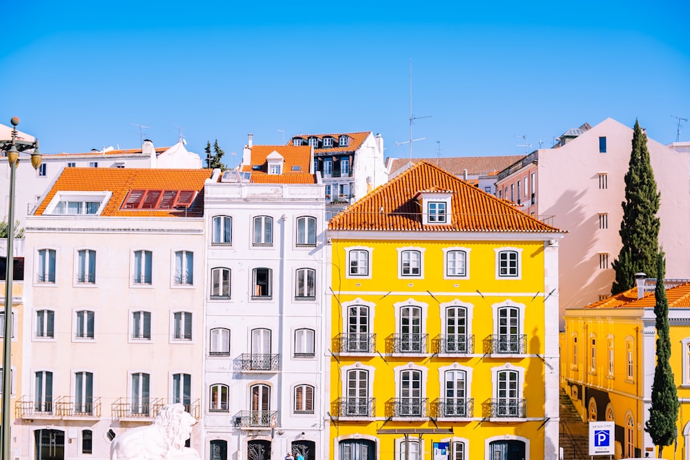 yellow and white multi-storey building facade