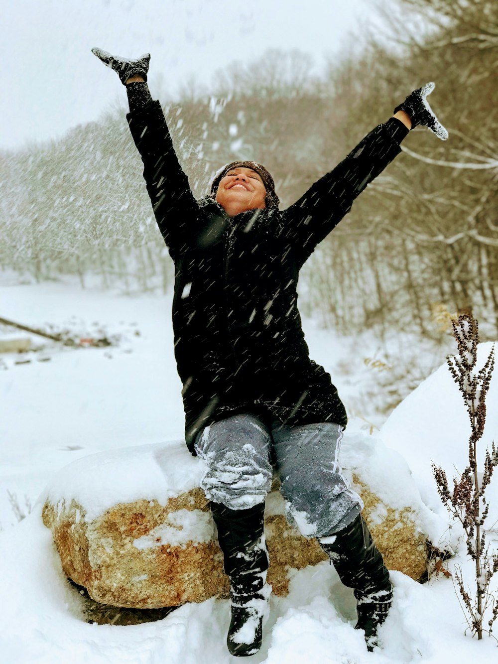 smiling woman wearing black coat