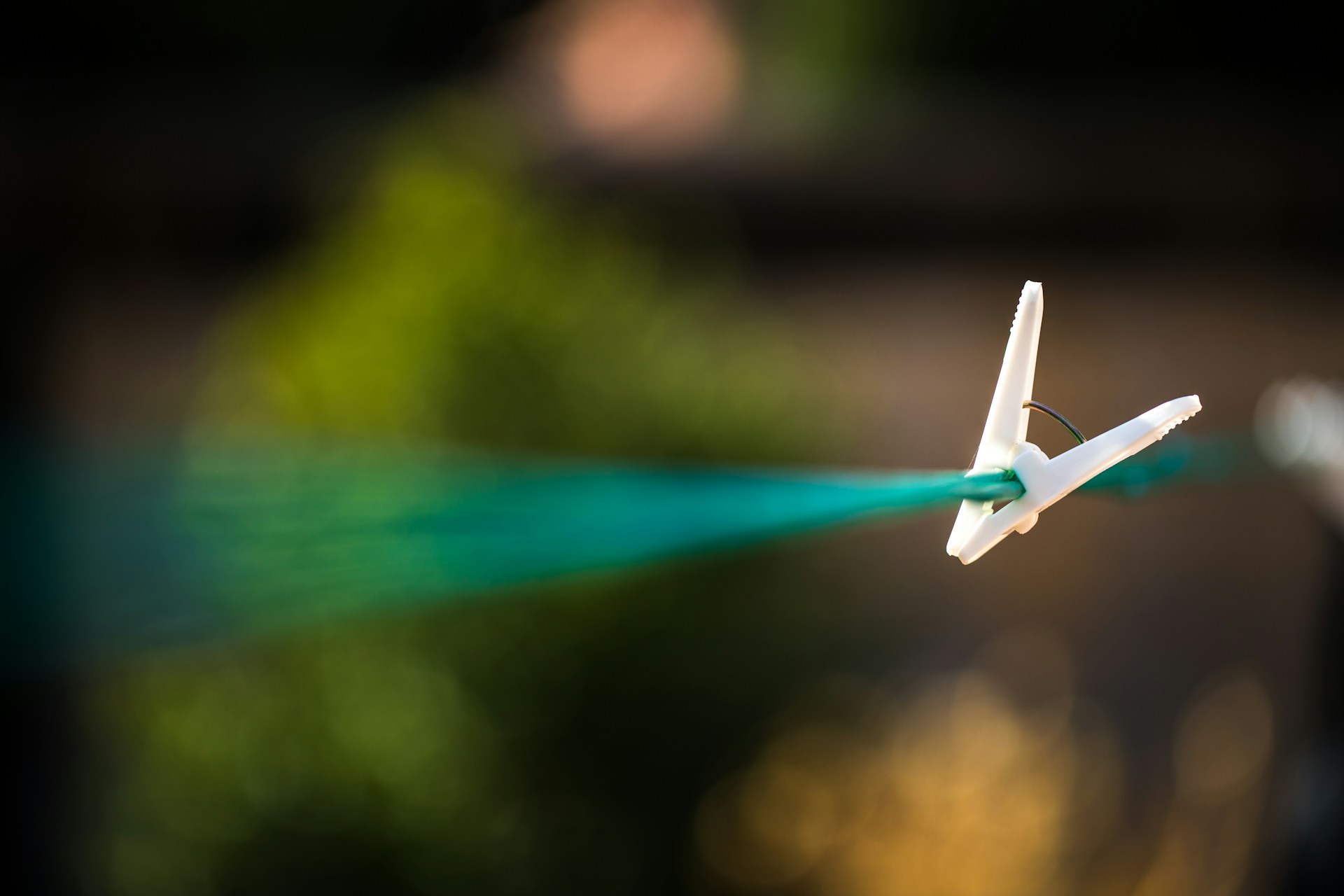 a toy airplane is flying through the air
