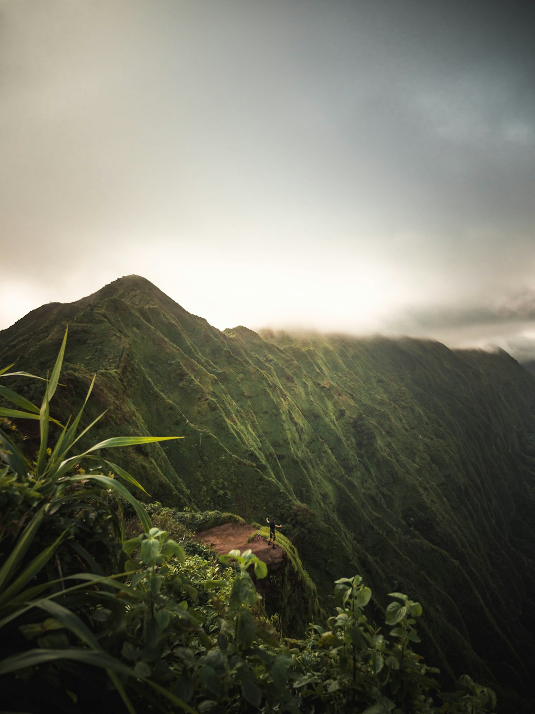 green mountain under cloudy sky