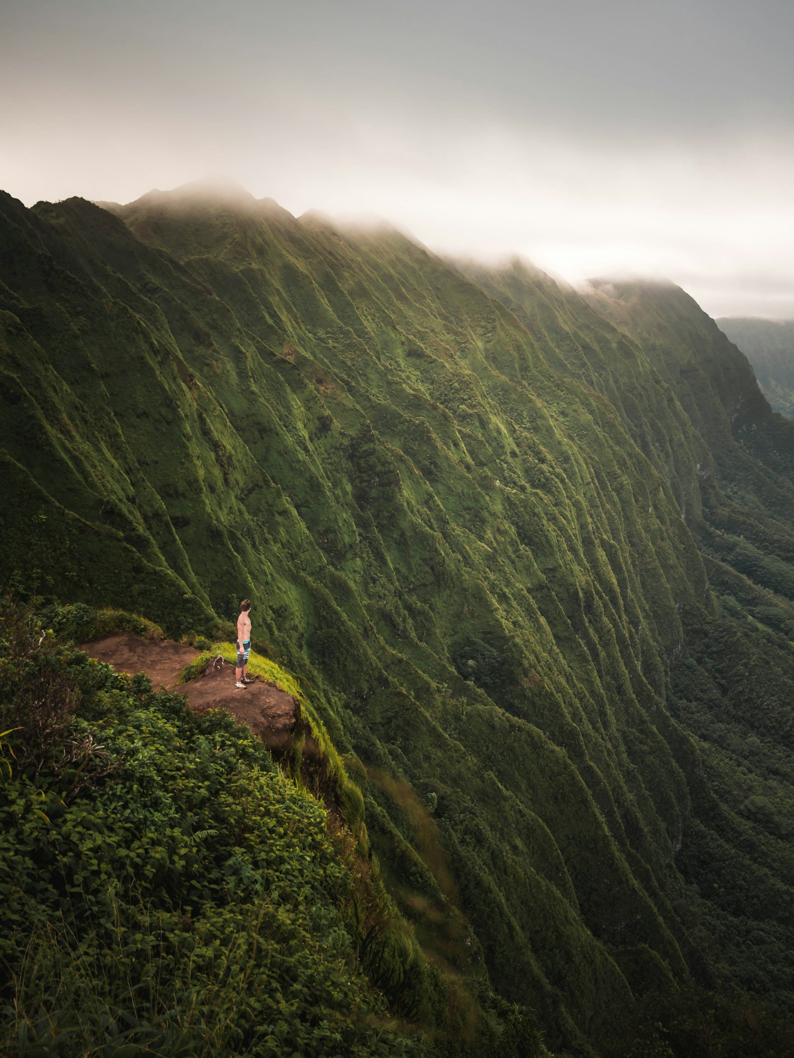 LUMIX G VARIO 12-35/F2.8II sample photo. Man standing on cliff photography