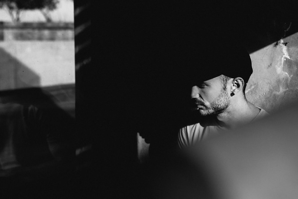 a black and white photo of a man with a beard