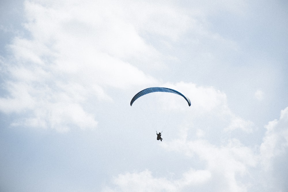 person riding on parachute