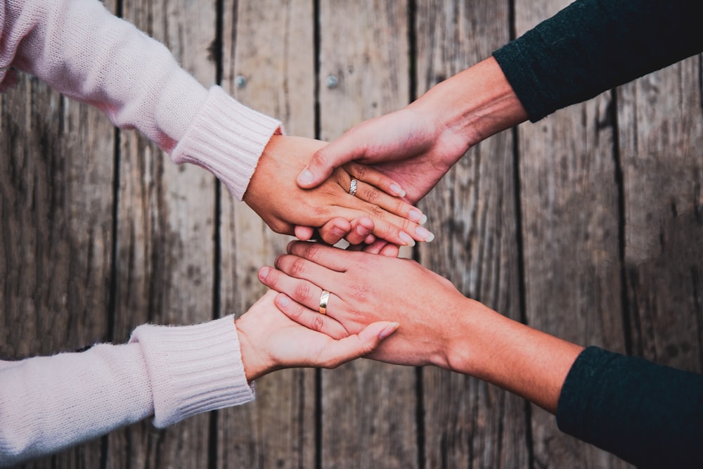 two people holding their hands