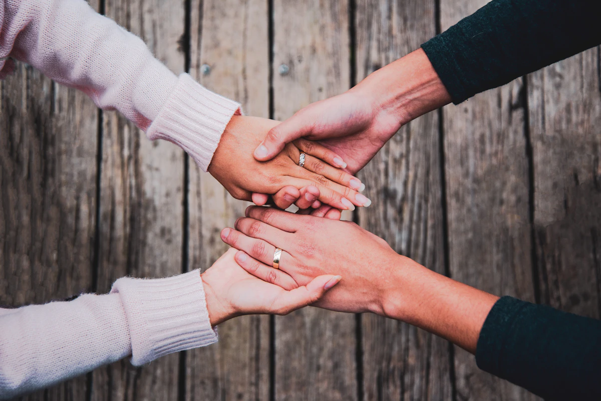 Holding hands warmly with partner demonstrating intimacy and support