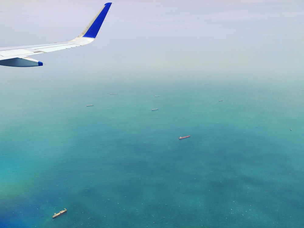 bird's-eye view photography of plane above ocean