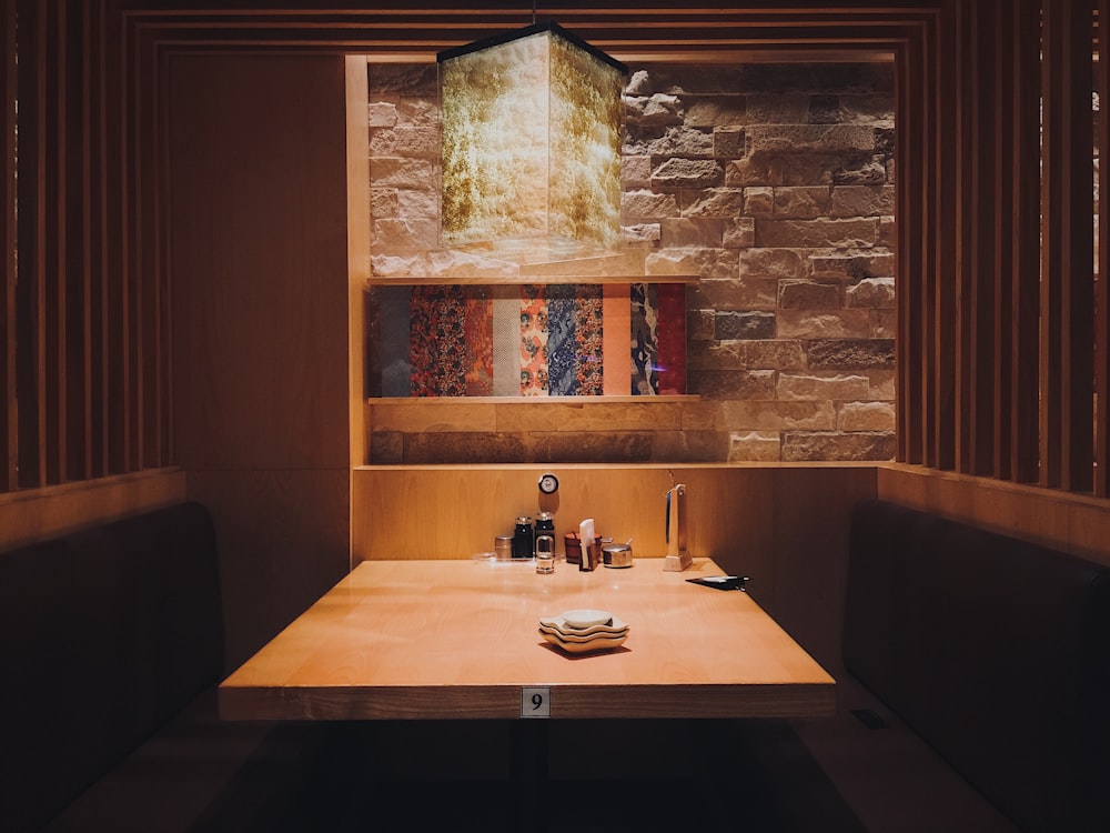 brown wooden table and leather benches