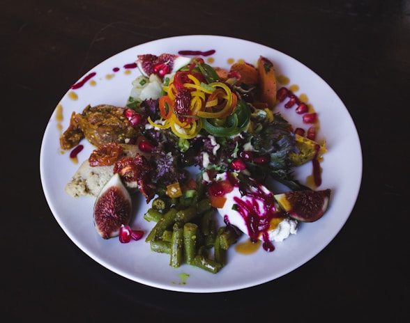 A beautifully arranged plate of colorful salads inspired by MENA cuisine.