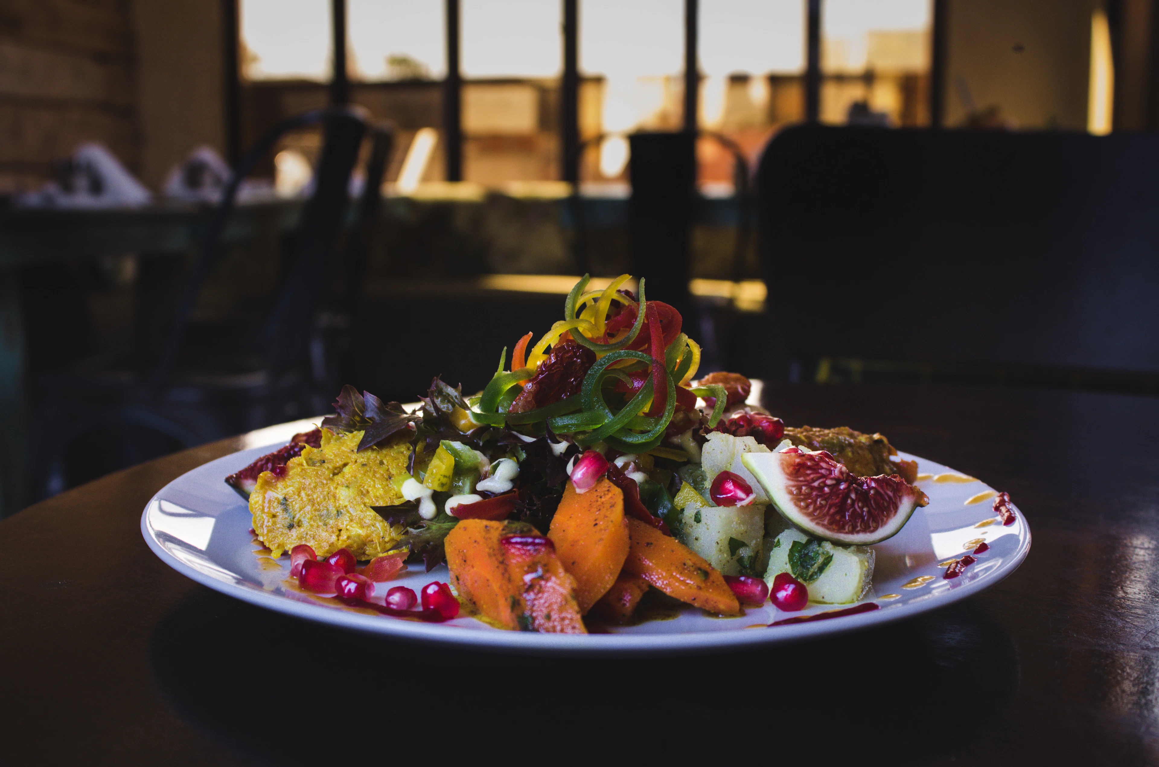 A delicate plated dessert in low light