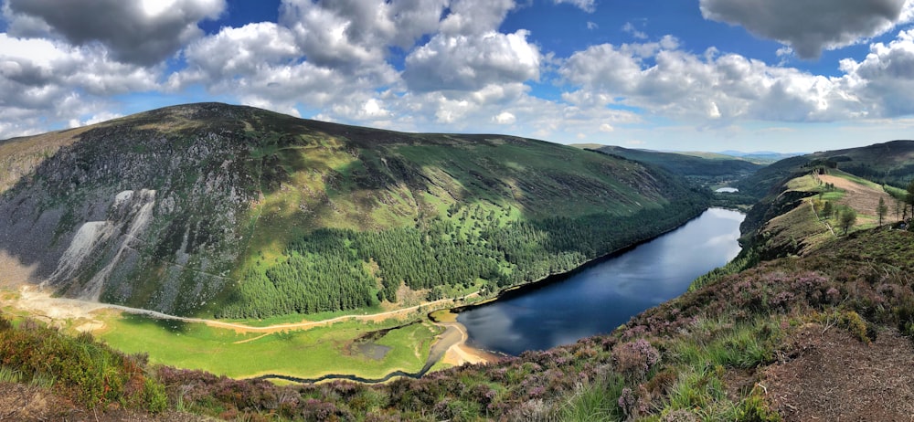 lake around mountain during daytime