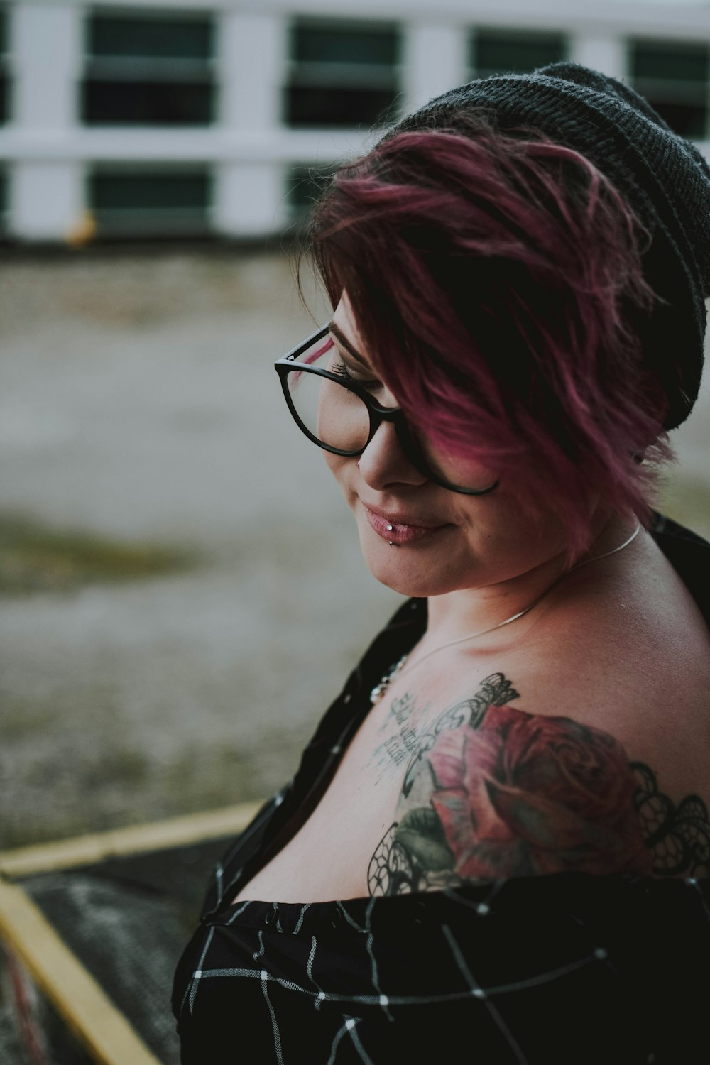 selective focus photography woman in black top wearing eyeglasses