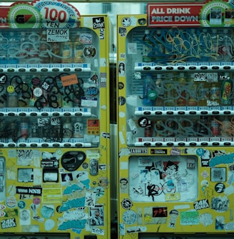 a vending machine with lots of stickers on it