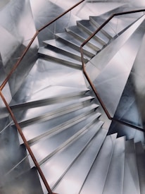 Close-up of a custom-made aluminum staircase installed in a modern home.