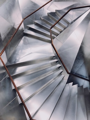 Close-up of a custom-made aluminum staircase installed in a modern home.