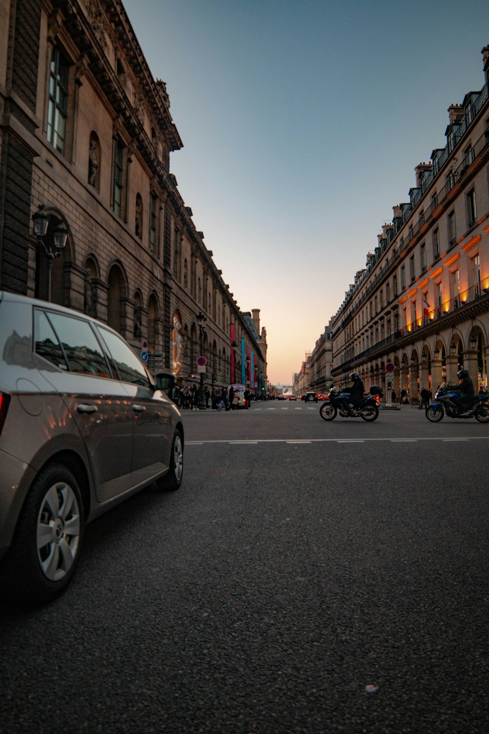 silver vehicle in road during golden hour