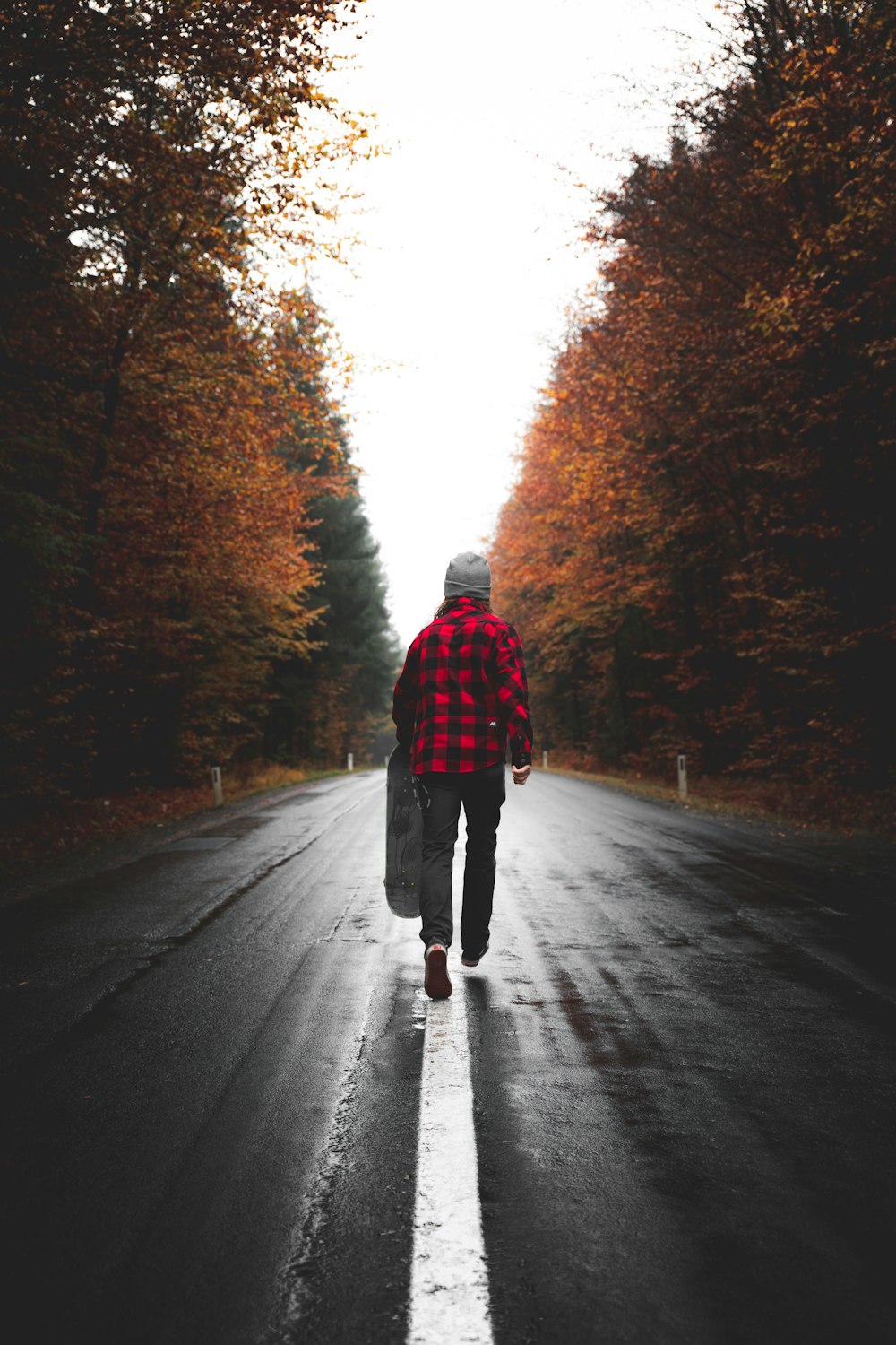 person walking on road