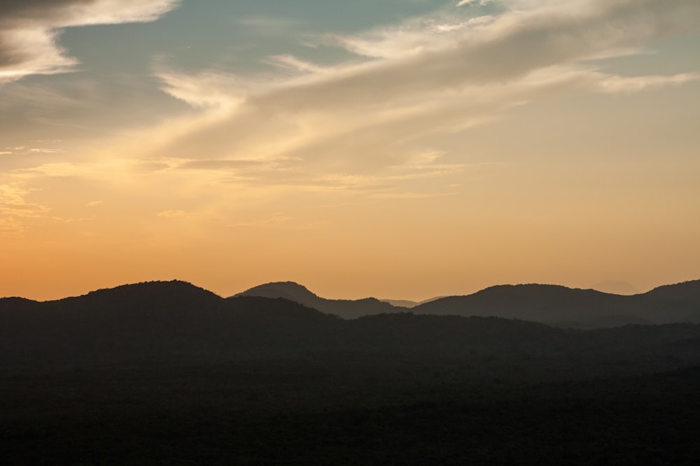 silhouette of mountain during daytime