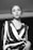grayscale photography of woman wearing V-neck long-sleeved dress