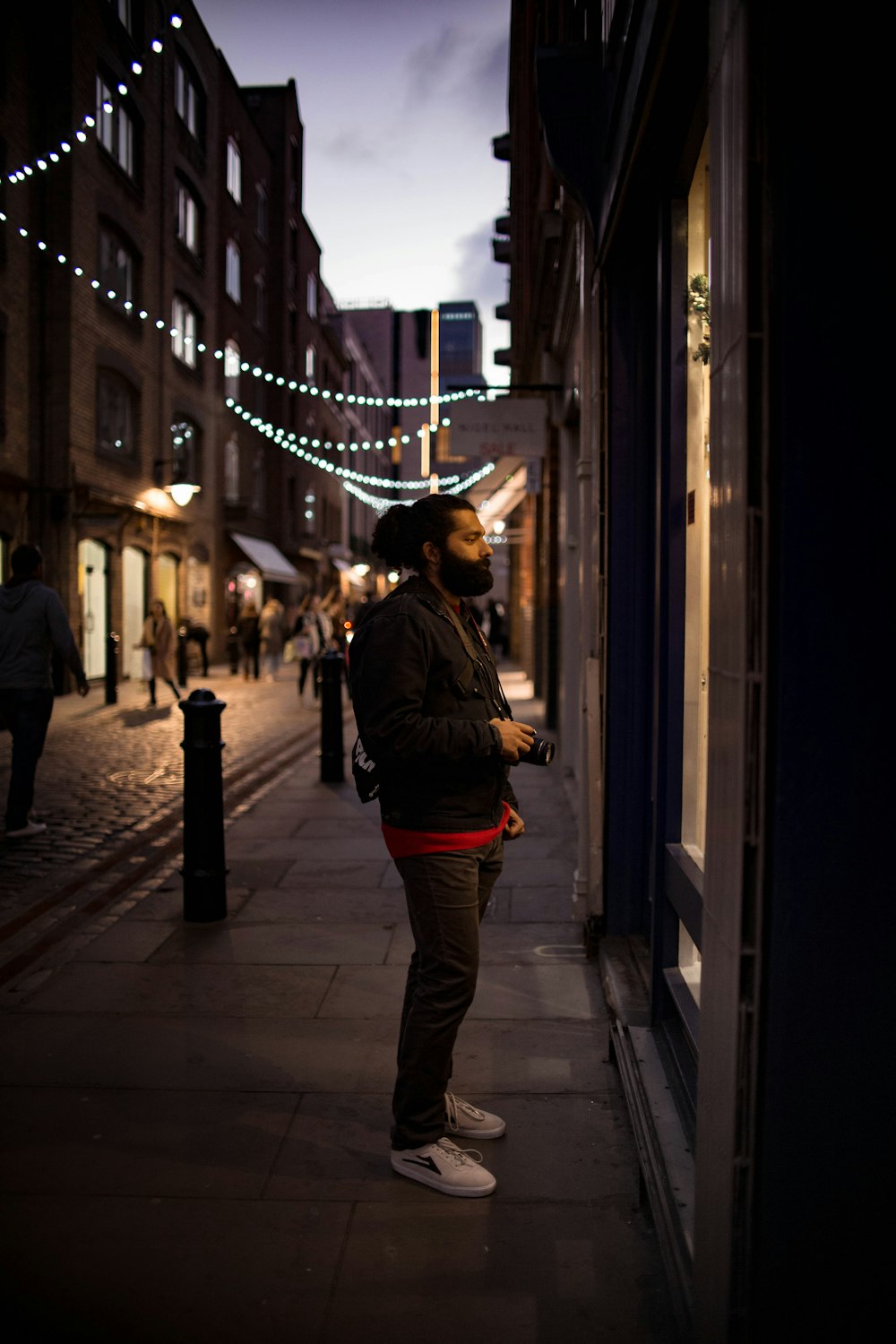 man wearing black jacket