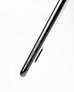 Side profile of a thin smartphone showing volume and power buttons