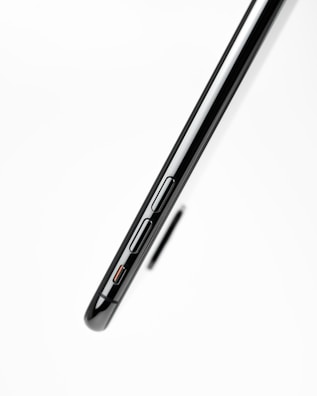 Side view of a sleek phone highlighting its slim design and buttons.