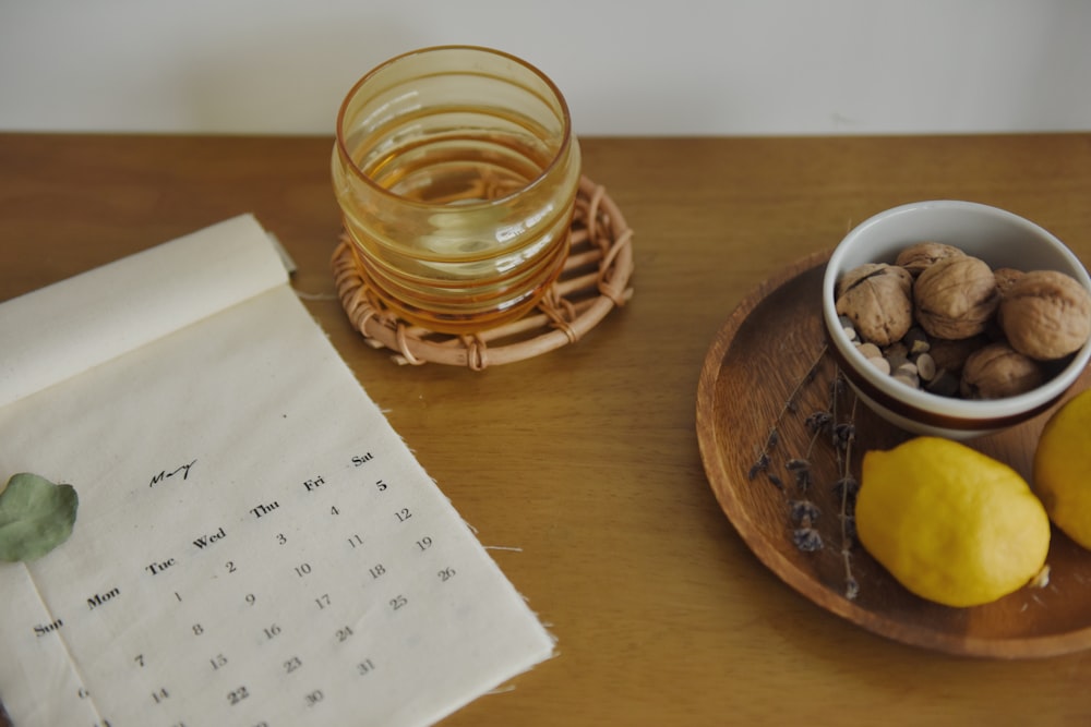 clear glass container beside calendar