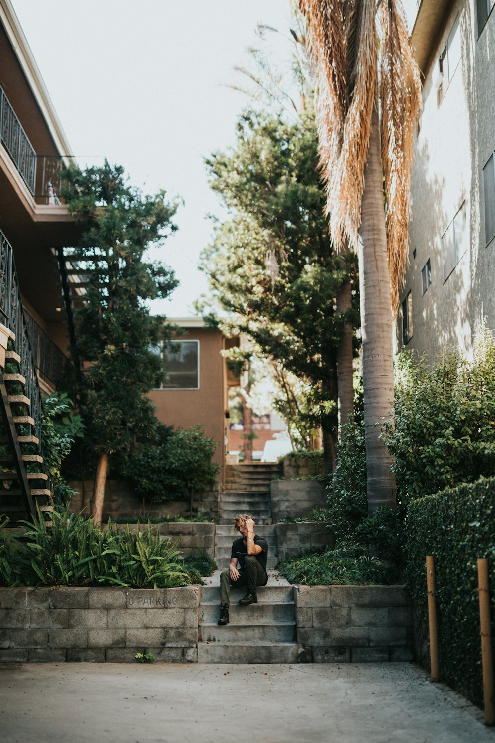 man sitting on staircase