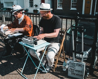 two men typewriting