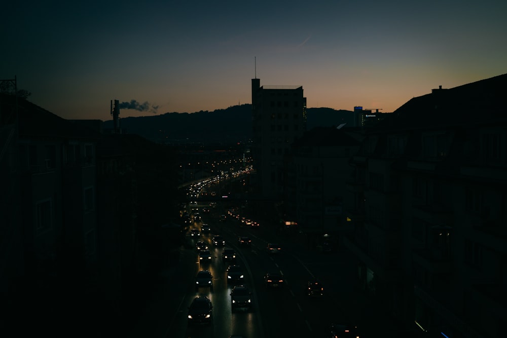 black vehicles at road during night time