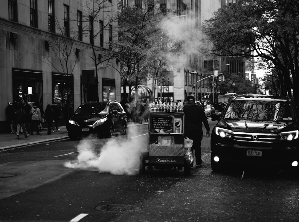 grayscale photography of vehicles on road