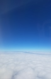 Floating clouds over an infinite horizon with a touch of surrealism.