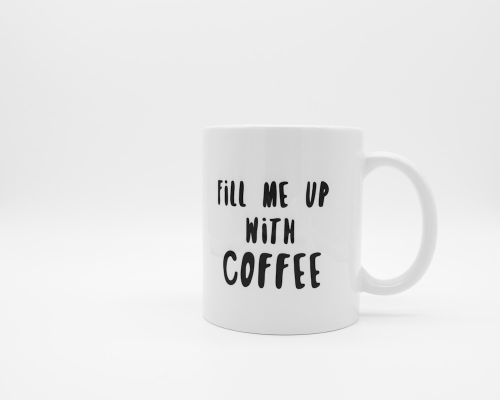 White ceramic mug with coffee on book page photo – Free Coffee cup Image on  Unsplash