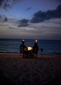 coupe on dinner date on seashore