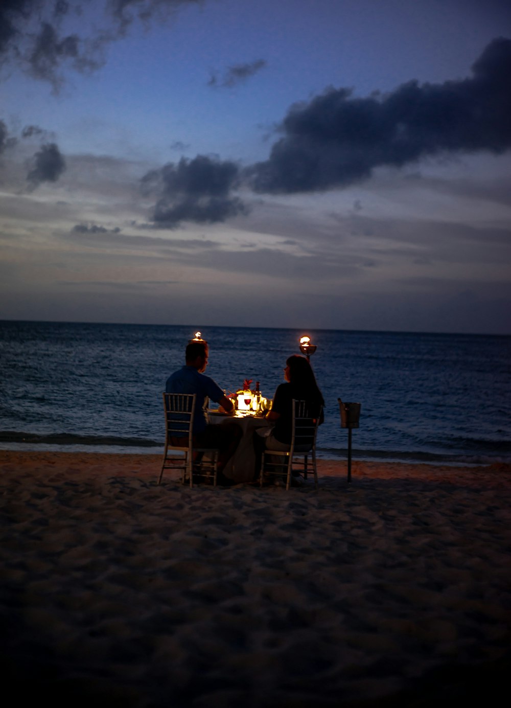 coupe on dinner date on seashore