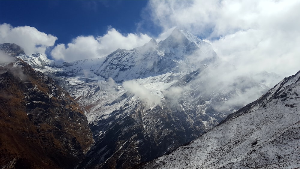 aerial photography of mountain covered with clouds