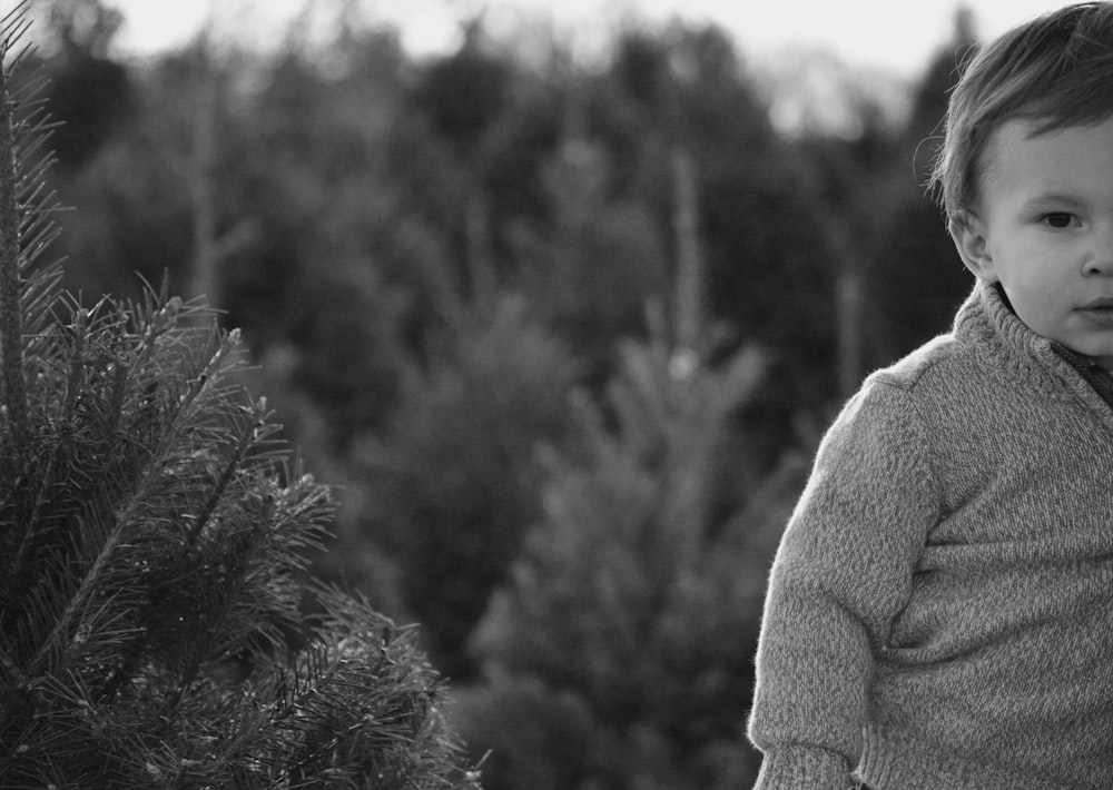 grayscale photo of woman in sweater