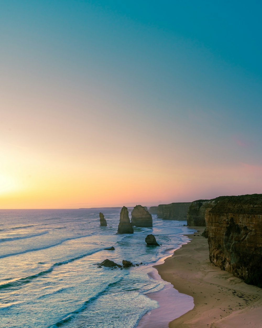 rock formations on body of water