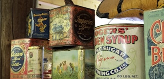 A variety of tin food cans showcasing different designs.