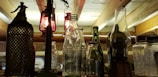 An artistic composition of vintage lamps on a rustic shelf.