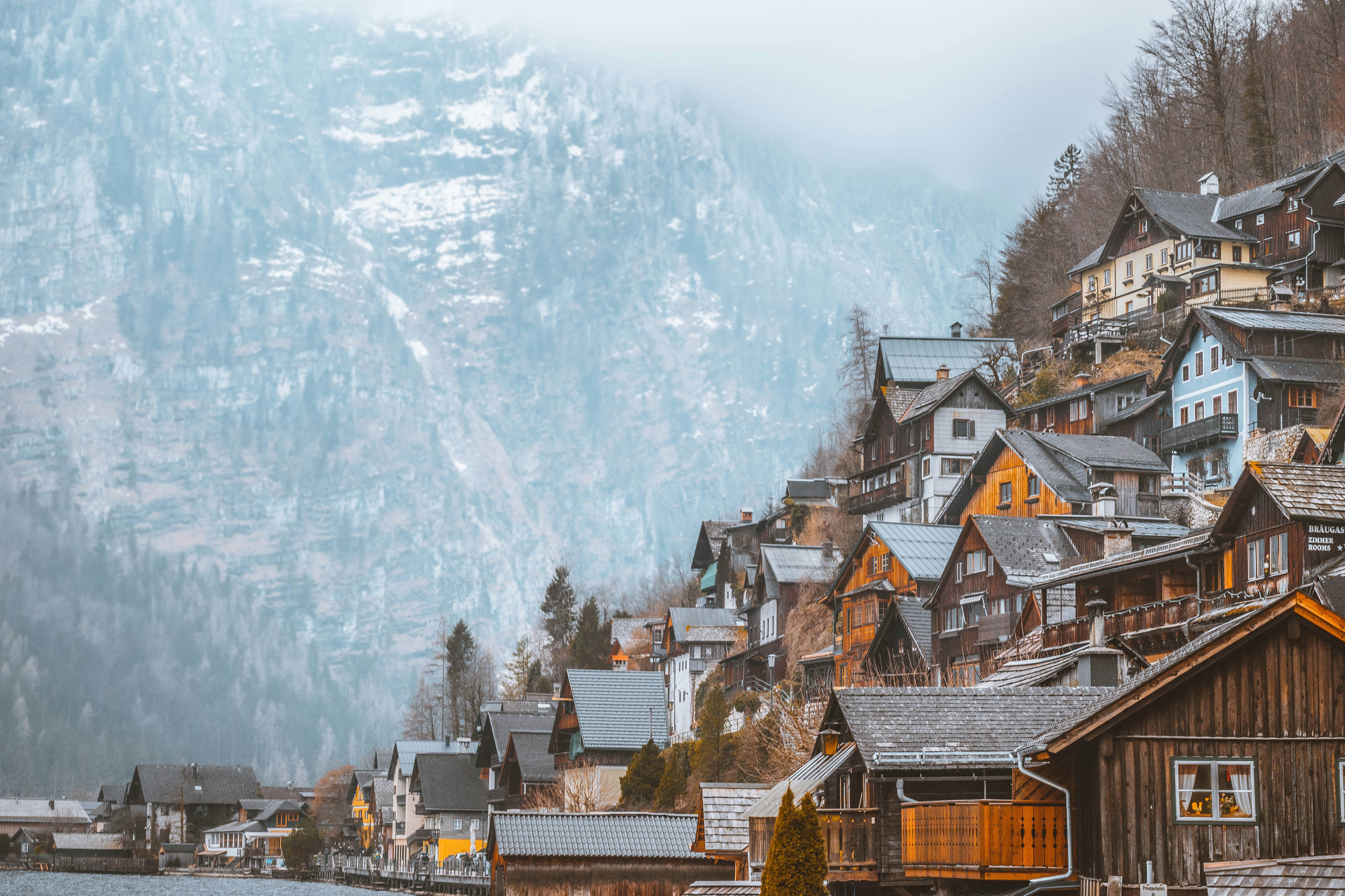 gray roof houses near mountain