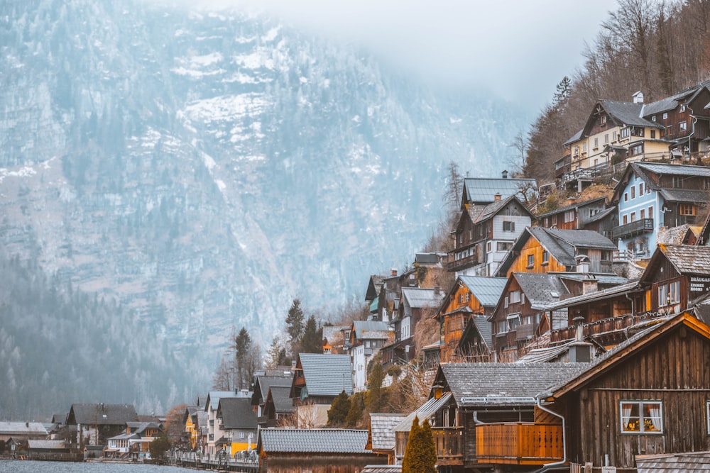 gray roof houses near mountain