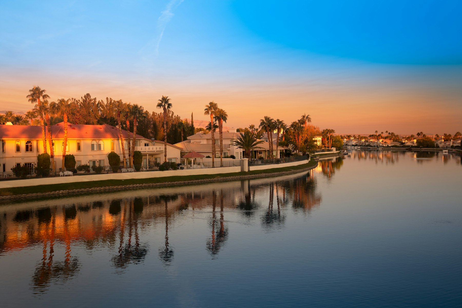 Luxury waterfront home at dusk