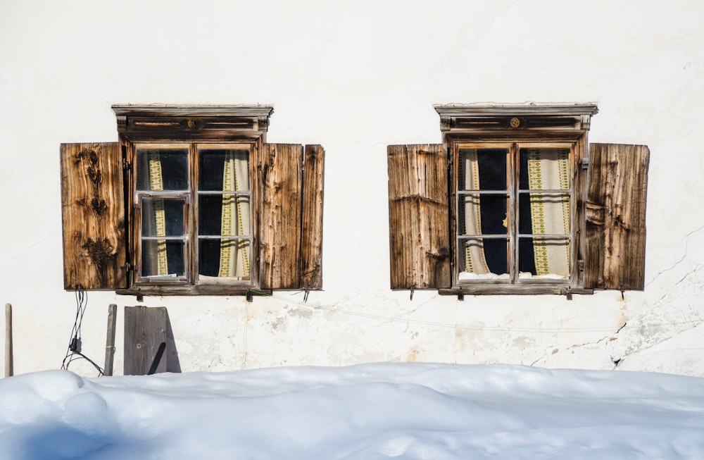 two brown wooden windows