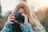 woman taking photo during daytime