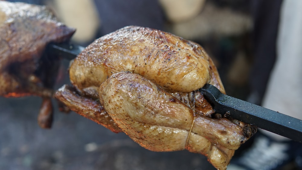 rotisserie chicken on black rod