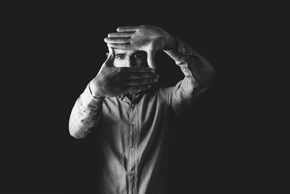 grayscale photography of man wearing dress shirt