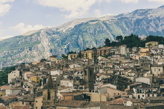 brown houses near mountain during daytime in Isnello Italy