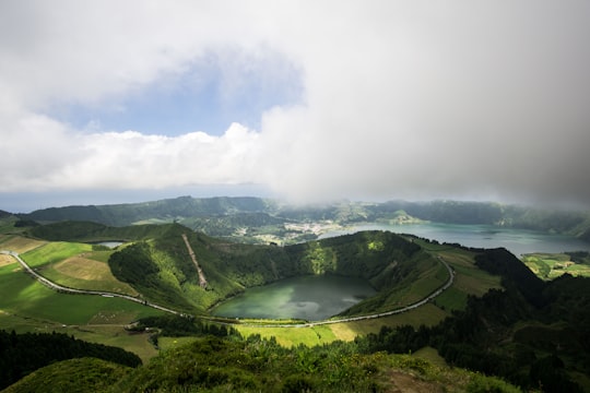 aerial photo of body lake in Miradouro da Boca do Inferno Portugal