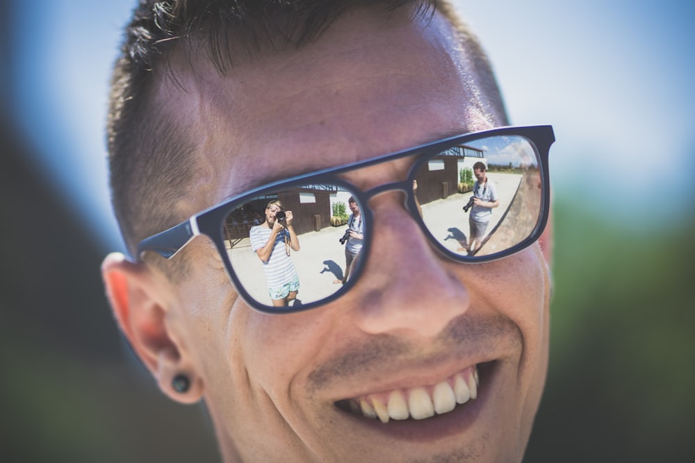 man in black framed sunglasses