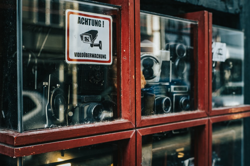 a red window with a sign on it that says aohtung